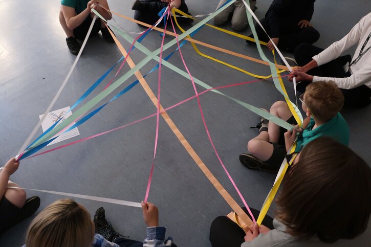 Students create a large-scale weaving together