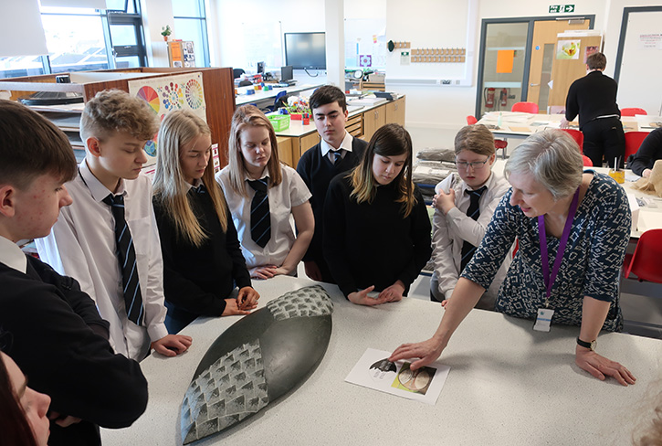 Sculptor Mary Bourne MRSS with her sculpture 'Shield', at Elgin High School, March 2020