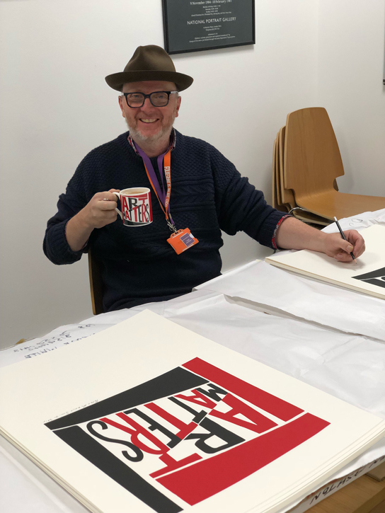 Bob and Roberta Smith signing the limited edition prints in the Art UK offices