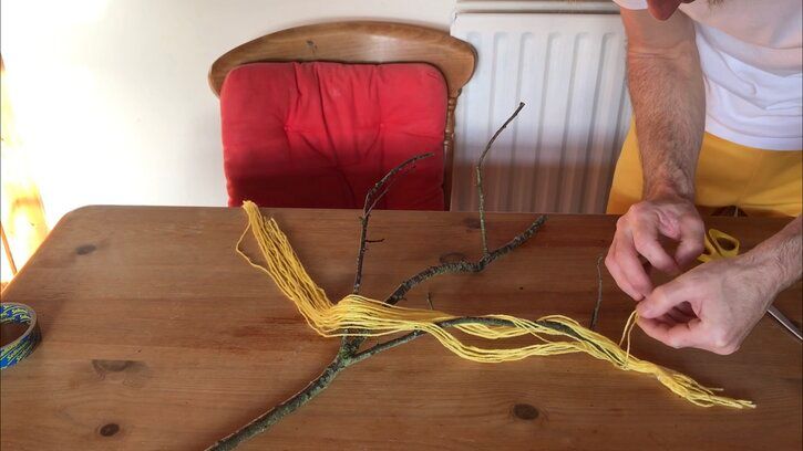 Brendan ties a slipknot around his branch