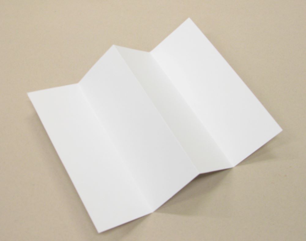Paper template folded into four equal sections