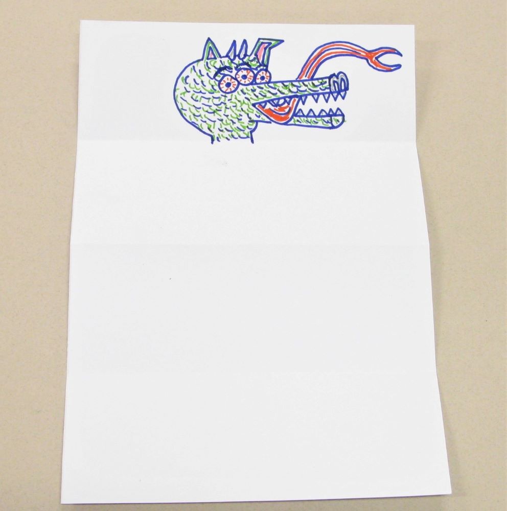 Draw your monster's head on the first section of the paper