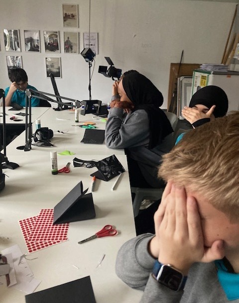 Students listening to sounds with their eyes closed