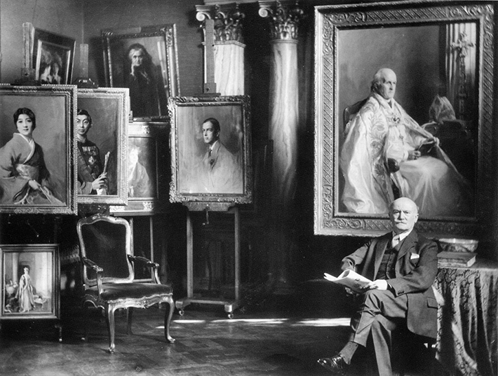 Philip de László in his studio at 3 Fitzjohn's Avenue with the portrait of Archbishop Lang, 1937