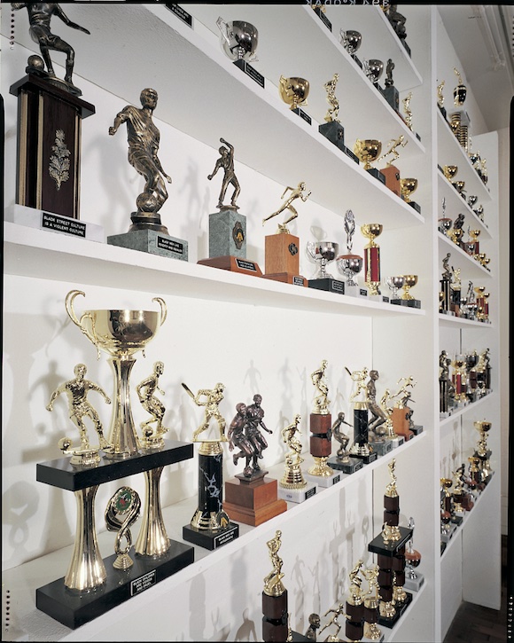 1992, trophies with engraved texts (glass cabinet, larger trophies and engraved captions with Eddie Chambers) by Donald Rodney (1961–1998)