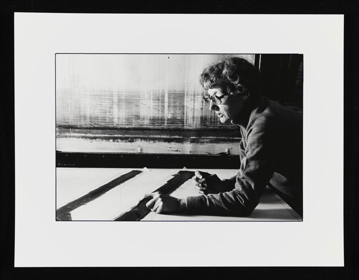 Black-and-white photograph of Prunella Clough in her studio