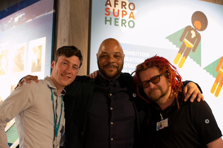 Adam, Jon Daniel and Yazz Vanducci, in front of Jon’s 'Afro Supa Hero' exhibition