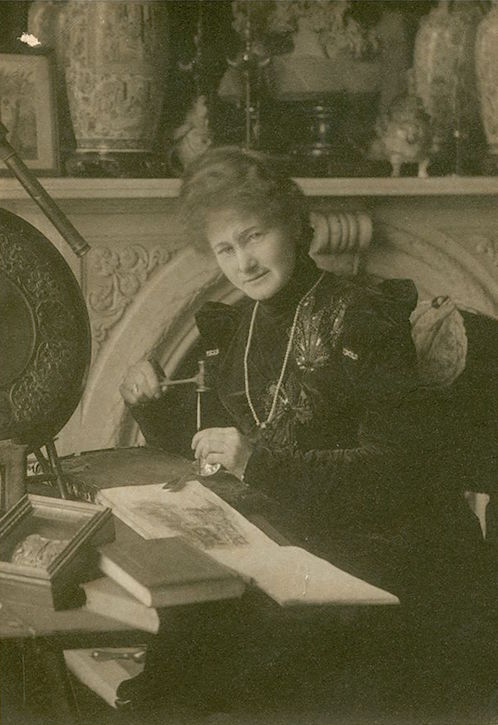 Agnes Baden-Powell engraving a spoon