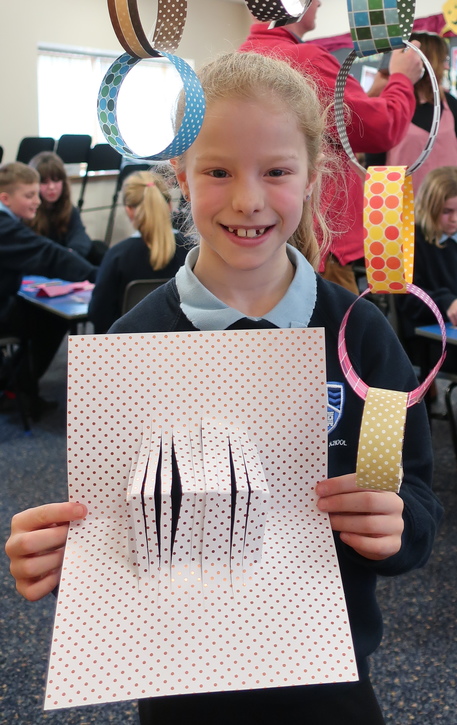 A student with her paper-cut work