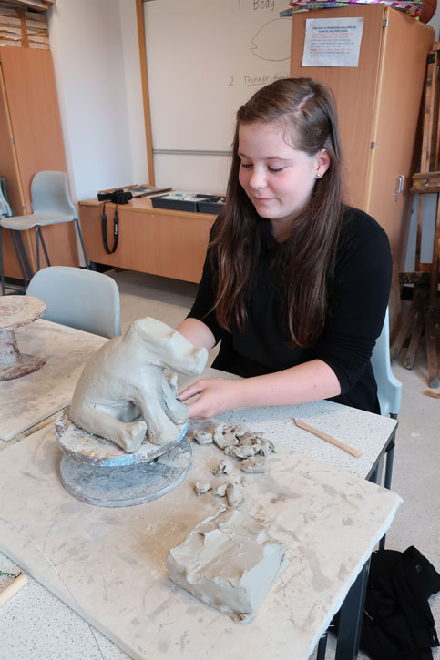 A pupil works with clay at a Masterpieces in Schools event