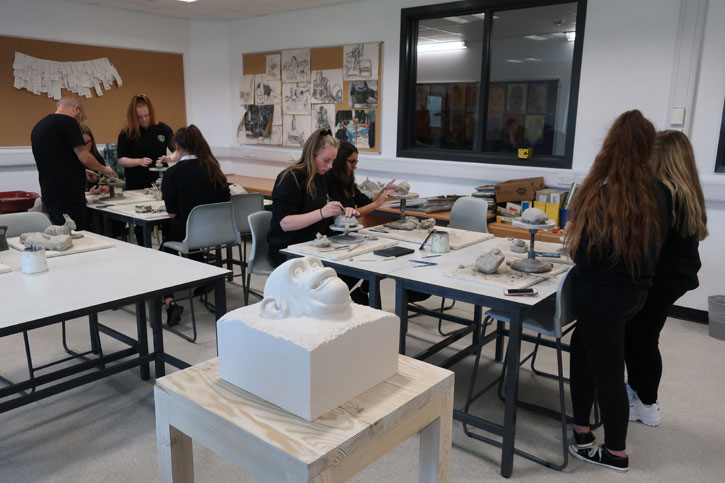 Pupils at a Masterpieces in Schools event with Kenny Hunter's 'Yield Brother'