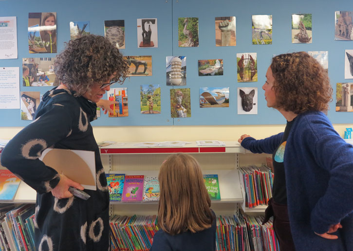 Artist Nicola Burrell discusses her work 'New Town' with a young participant and Selina Levinson Drake, Learning and Engagement Manager at Art UK