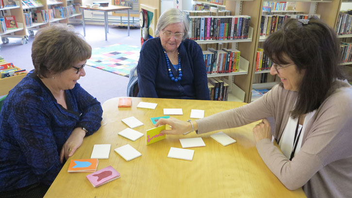 Invitation to Play games session at Tye Green Library, with cards made by the Brownies