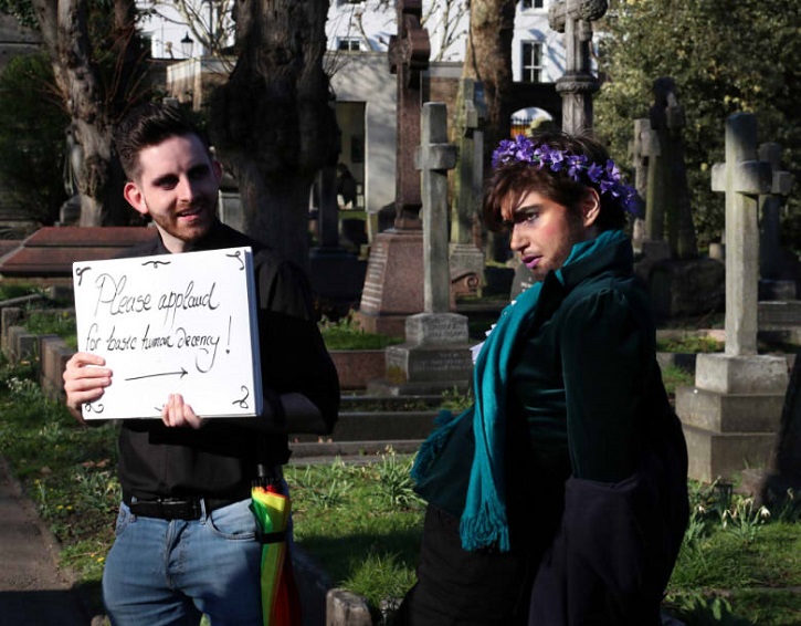 Claire as Eugène Delacroissant performing in front of Emmeline Pankhurst's memorial