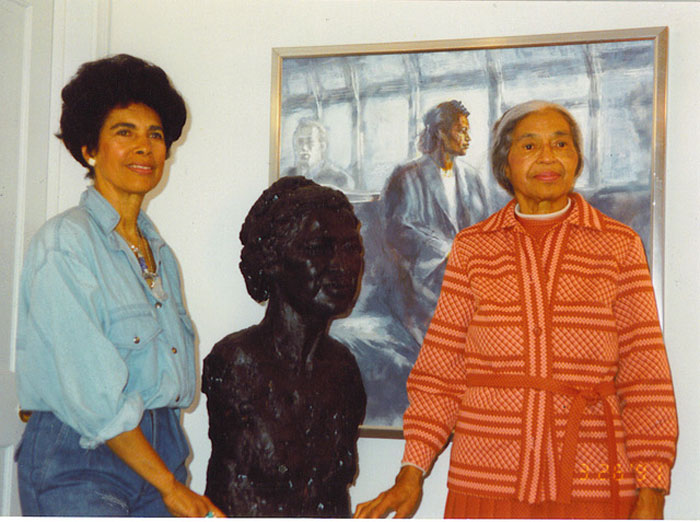 Artis Lane and Rosa Parks standing next to Lane's sculpture and painting of Parks