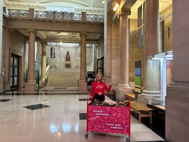 Dr Caroline Lloyd with the Explore trolley at National Museum Cardiff