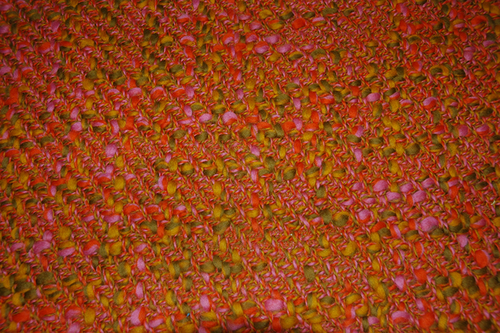 Tweed using slubby and multiply yarns in pink, green, yellow and orange