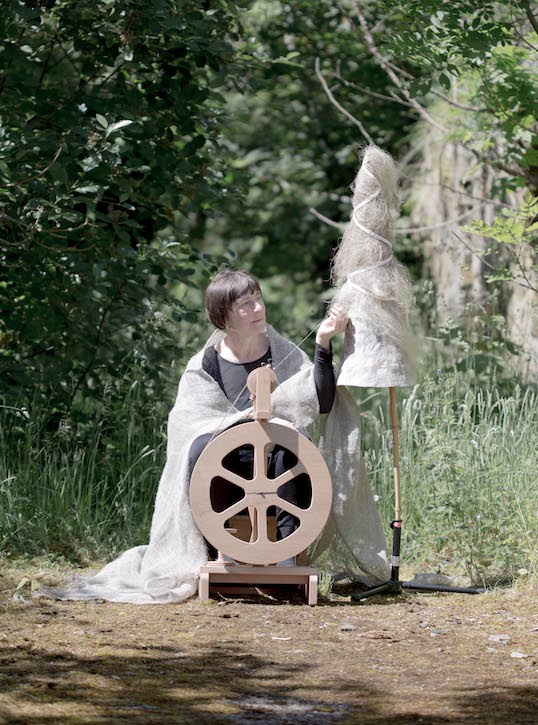 Christine Borland spinning as part of her Flax project