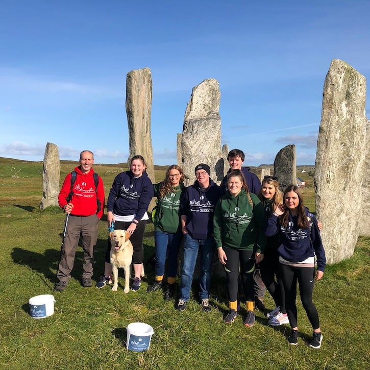 An Lanntair staff at the Callanish Stones as part of their Travel Plan project