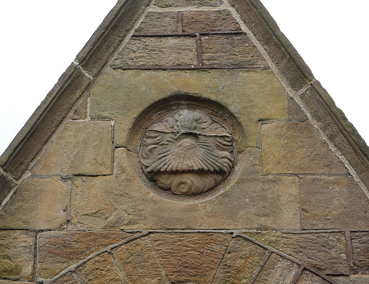 A relief of the Eye of Providence on the north gable of the chapels at Flaybrick Memorial Gardens