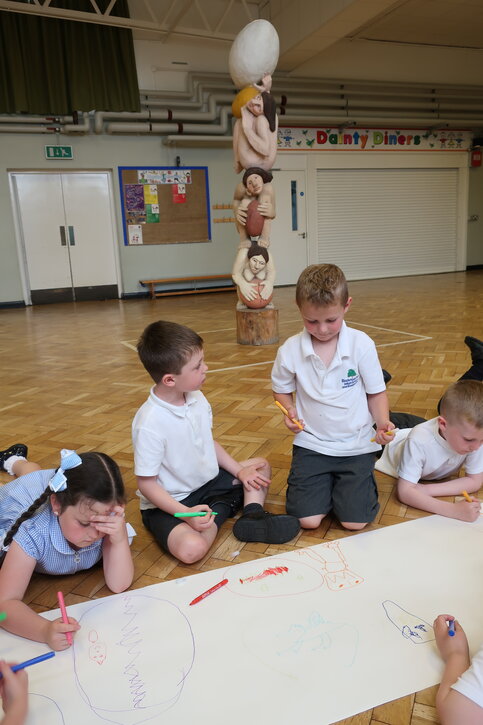 Pupils draw what they think may be inside the sculpture’s eggs