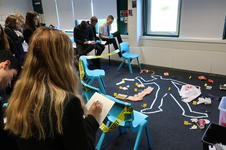 Students investigate their crime scene