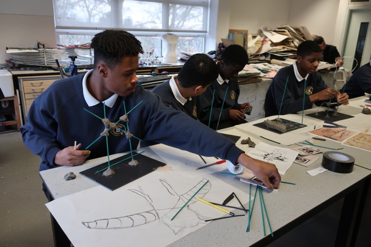 Students build sculptures in a workshop