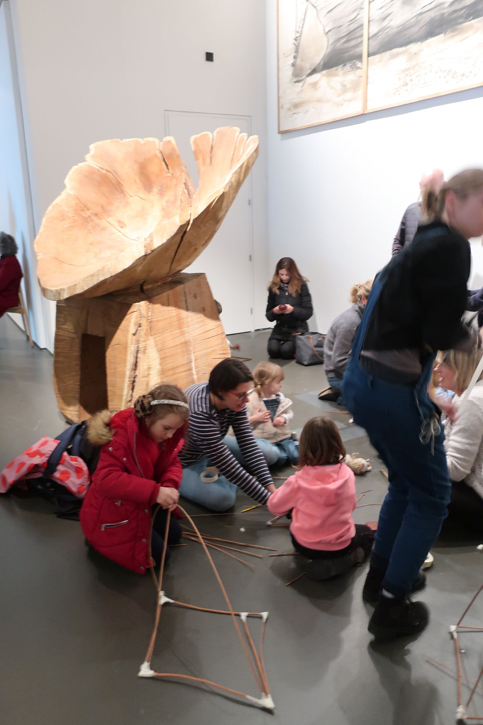 Families working amongst artwork in the Nash show