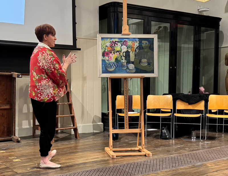 Teacher Penny Huntsman looks at a Mary Fedden painting