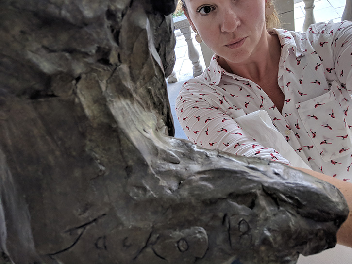 Laura Davidson takes an accidental selfie photographing a signature on the back of a sculpture