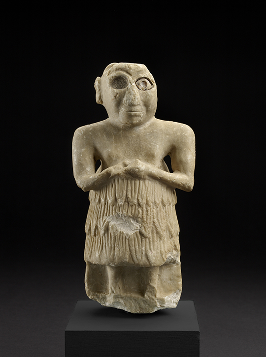 Sumerian statue of a male worshipper originally placed in a temple as a dedication to the gods