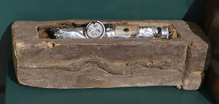 A tube of mummy brown in a coffin that was probably originally made for an eel or snake