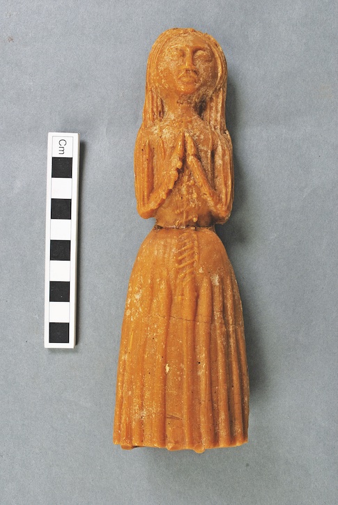 Wax votive figure of a young woman