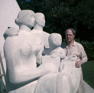 Henry Moore with 'Harlow Family Group', 1954–1955 (LH 364) outside the Top Studio, Perry Green
