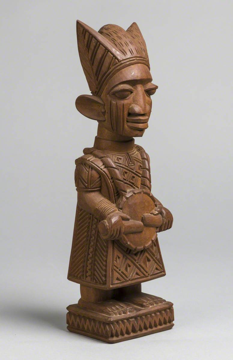 Male Figure with Drum and Headdress