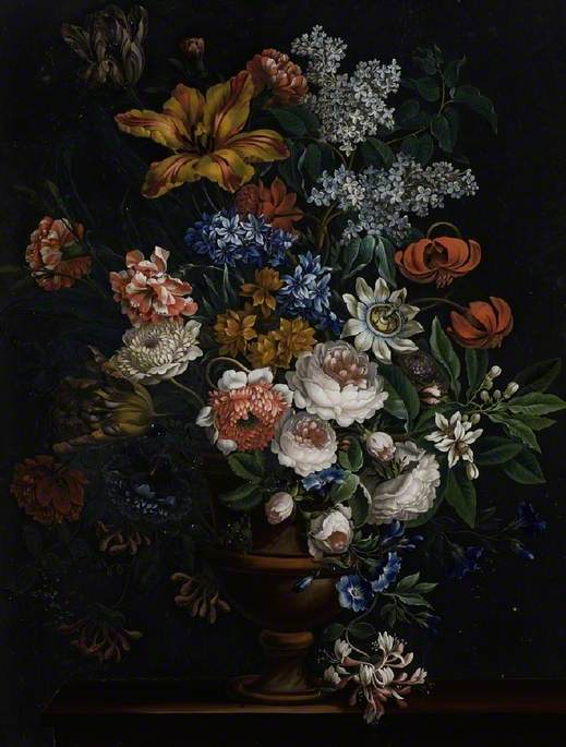 Assorted Flowers in an Urn on a Brown Ledge