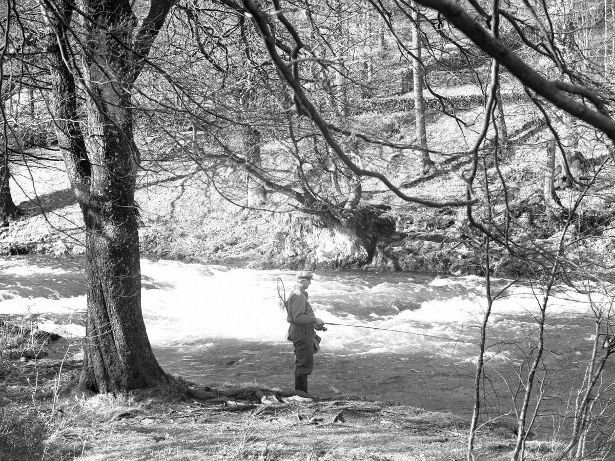Man Fishing in River