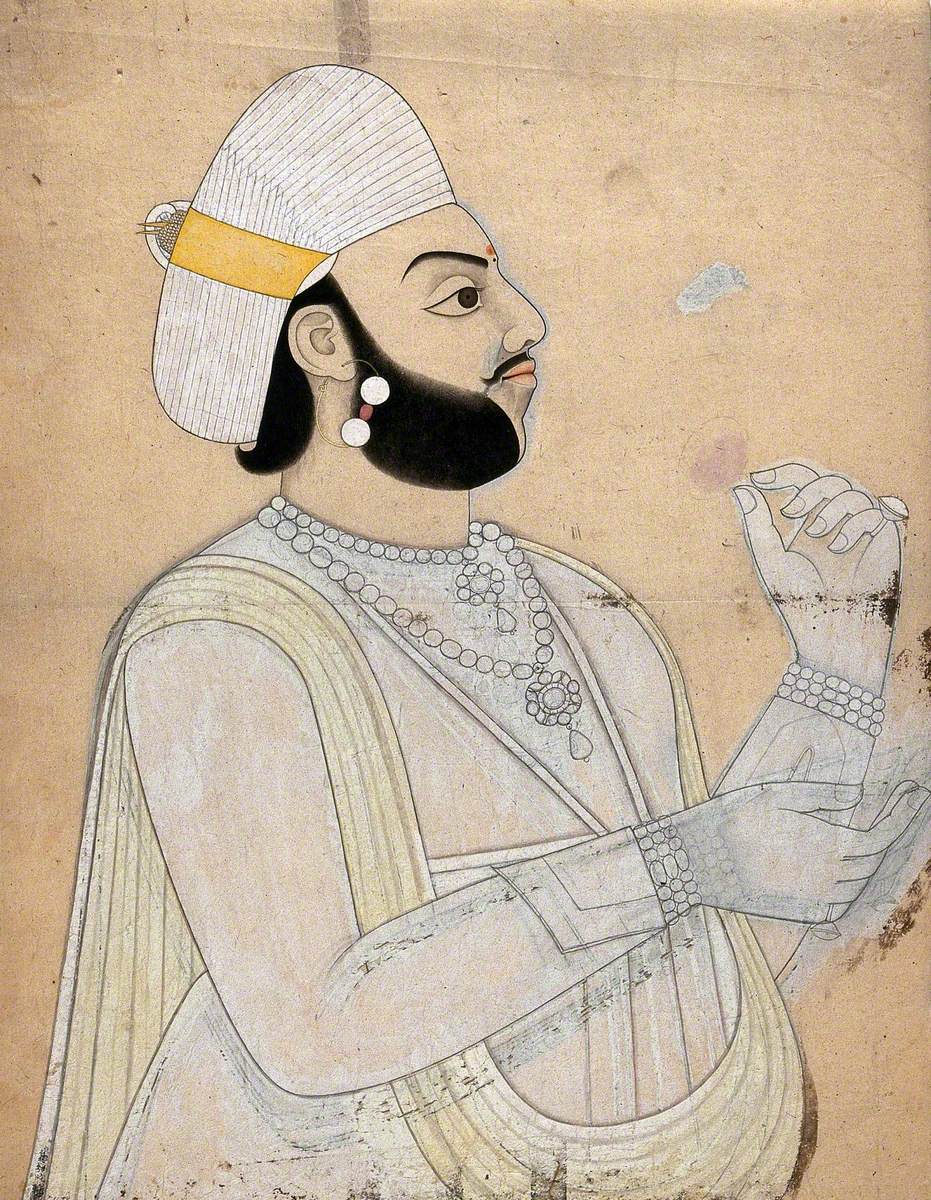 A Raja Holding a Rose