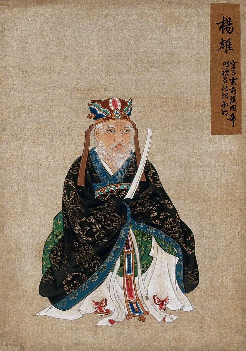 A Seated Chinese Figure with White Beard Wearing an Elaborate Headdress