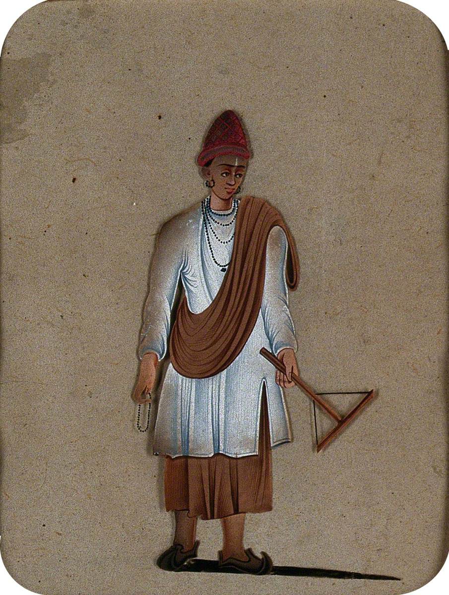 A Young Man Holding Rosary Beads in One Hand and a Tool of His Trade in the Other