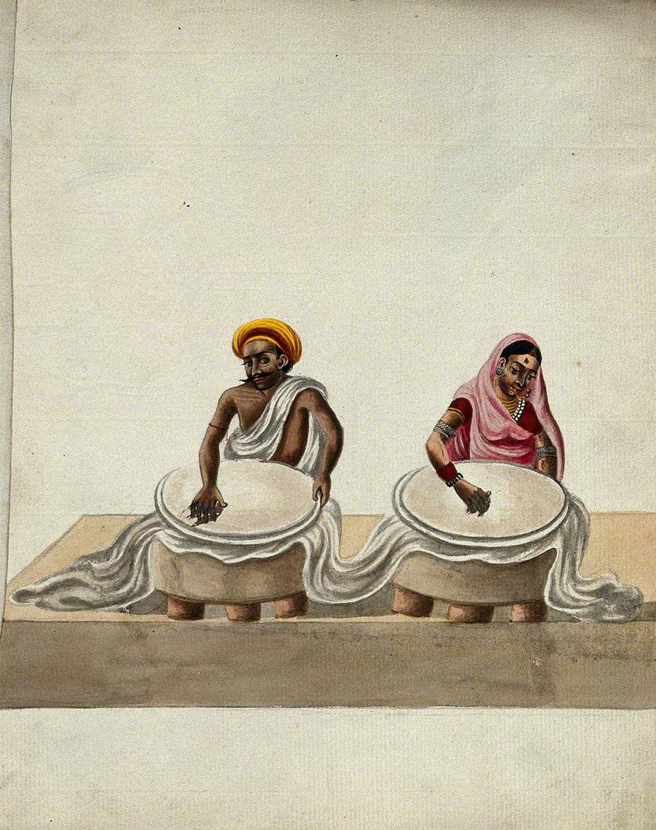 A Man and a Woman Rubbing a Piece of Batik Cloth (?)