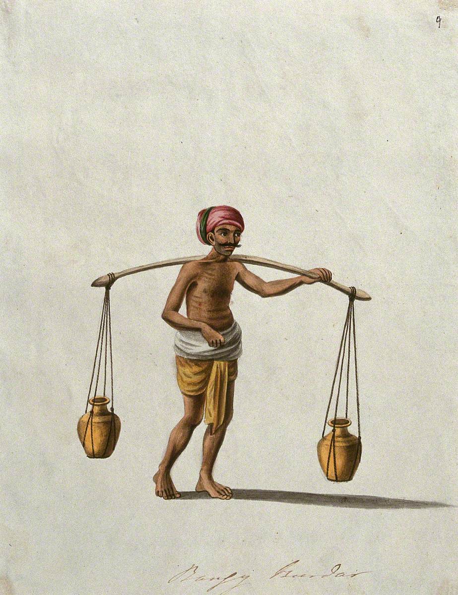 An Indian Man Maybe Selling Milk or Water Carrying Two Pots Suspended on a Pole on His Shoulder
