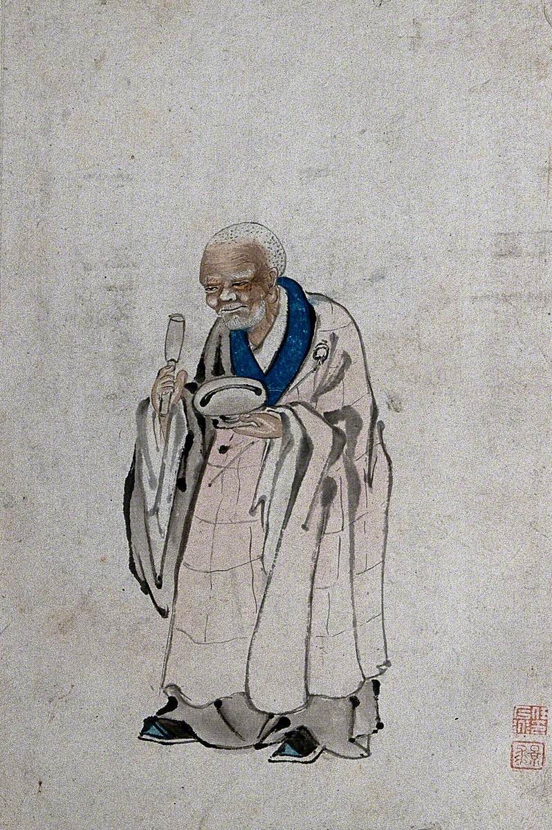 A Standing Chinese Man Holding a Pestle and Mortar