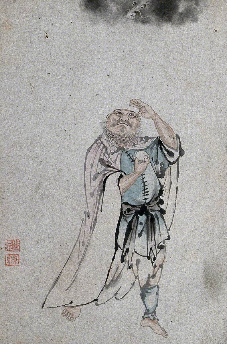 A Chinese Man Holding an Egg or Cake and Looking Upwards