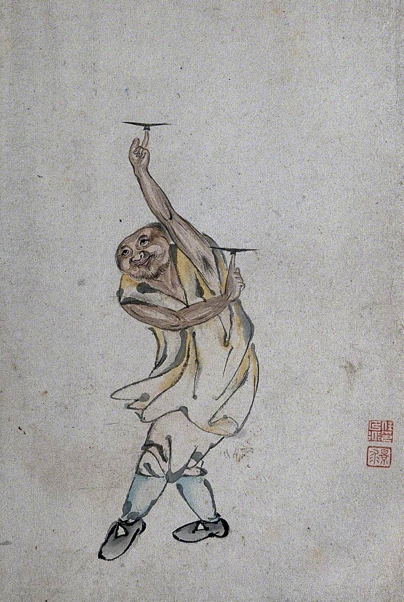 A Chinese Man Spinning Plates on His Index Fingers