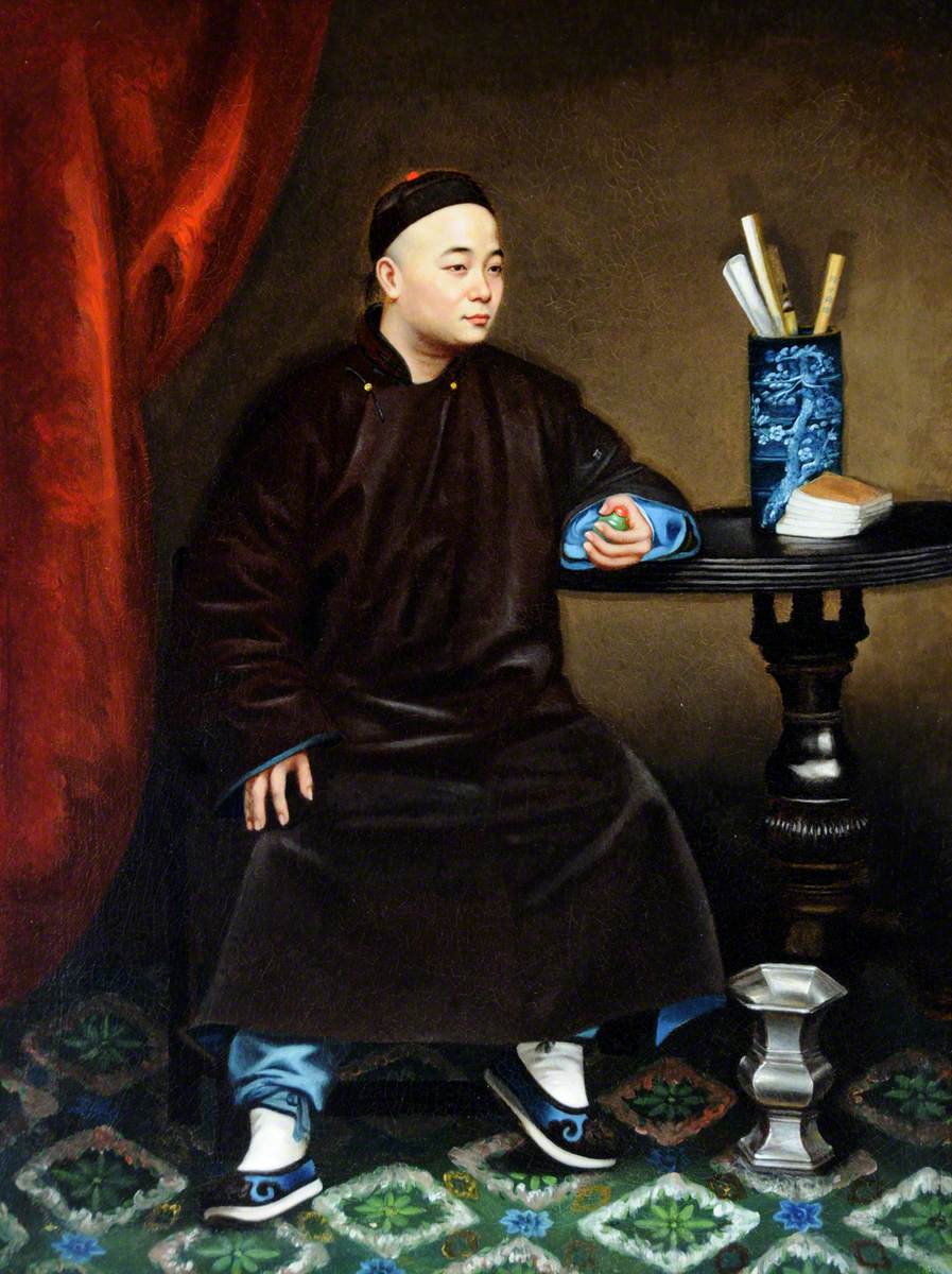 A Chinese National Holding a Snuff Bottle