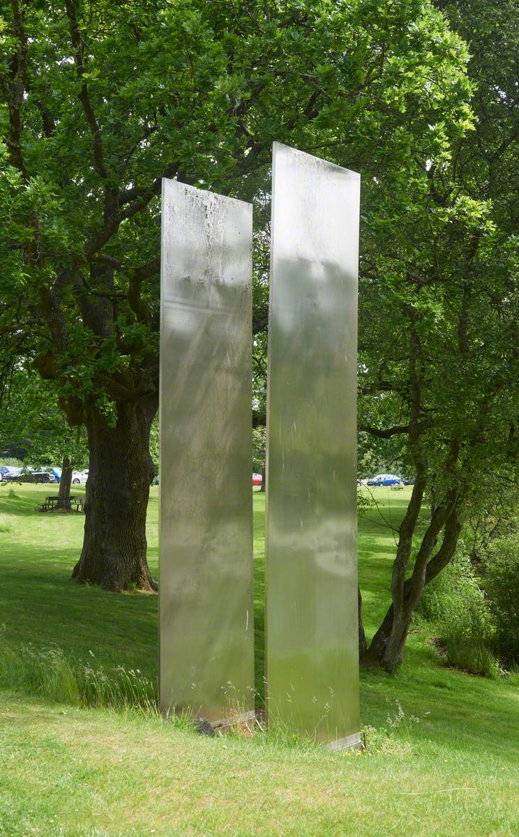 Two Stainless Steel Forms with White