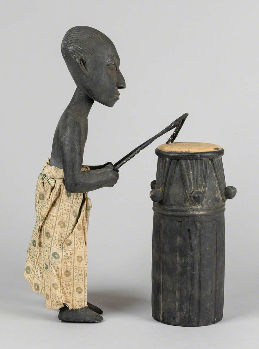 Man Playing a Drum*