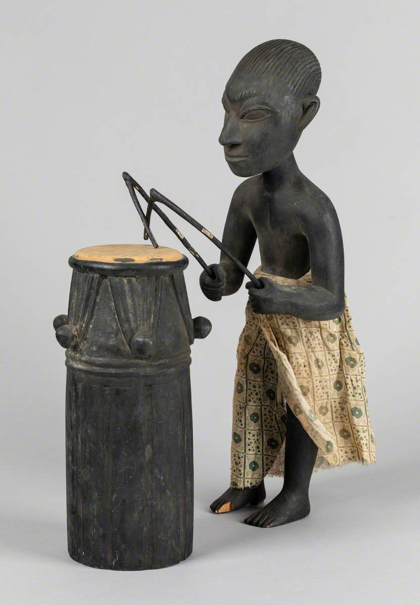 Man Playing a Drum*