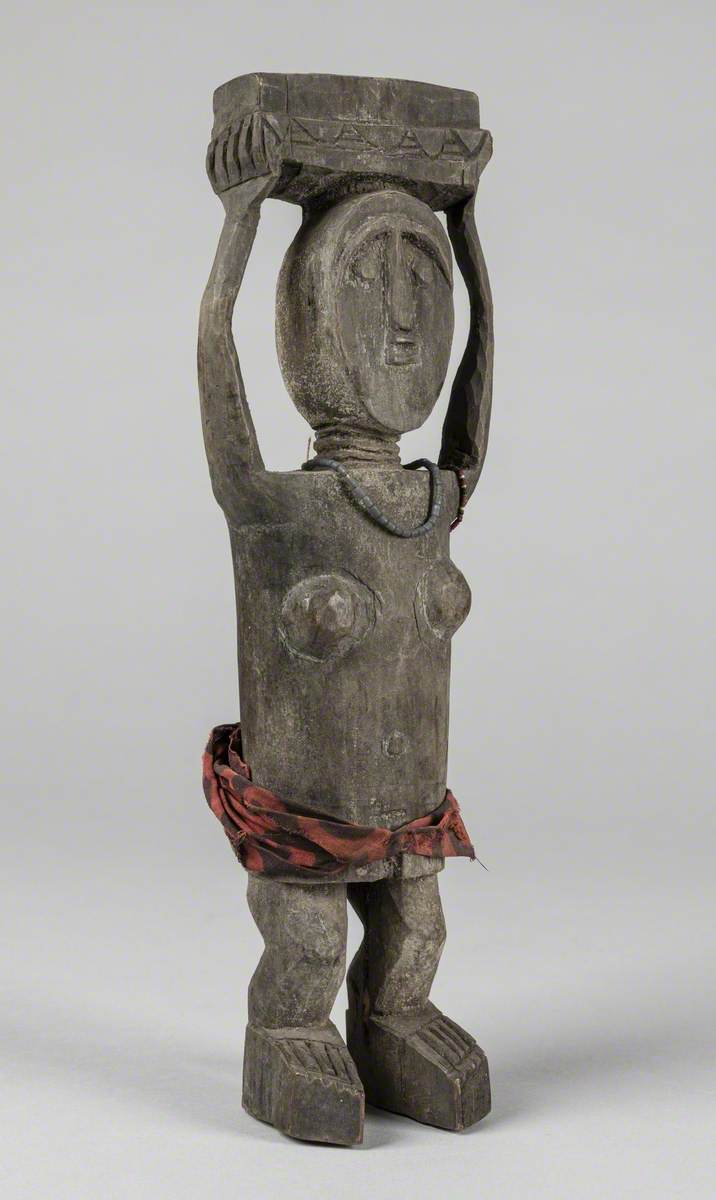 Woman Carrying an Adaka*